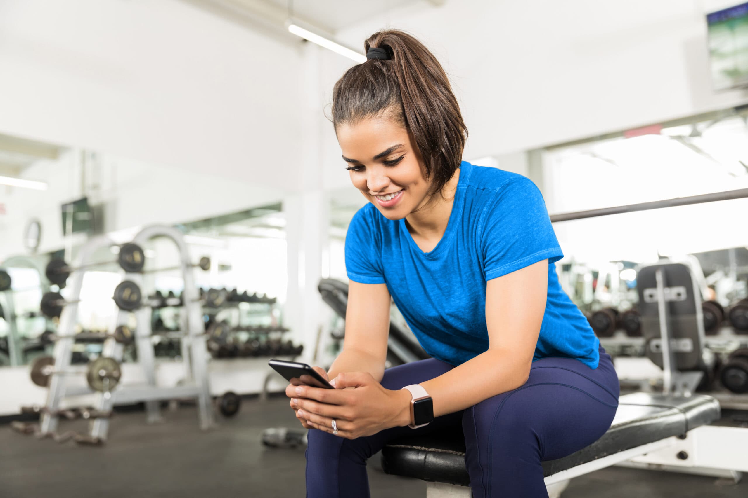Gym owner using automation software to manage operations and member engagement