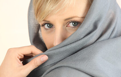 woman-hiding-in-blanket