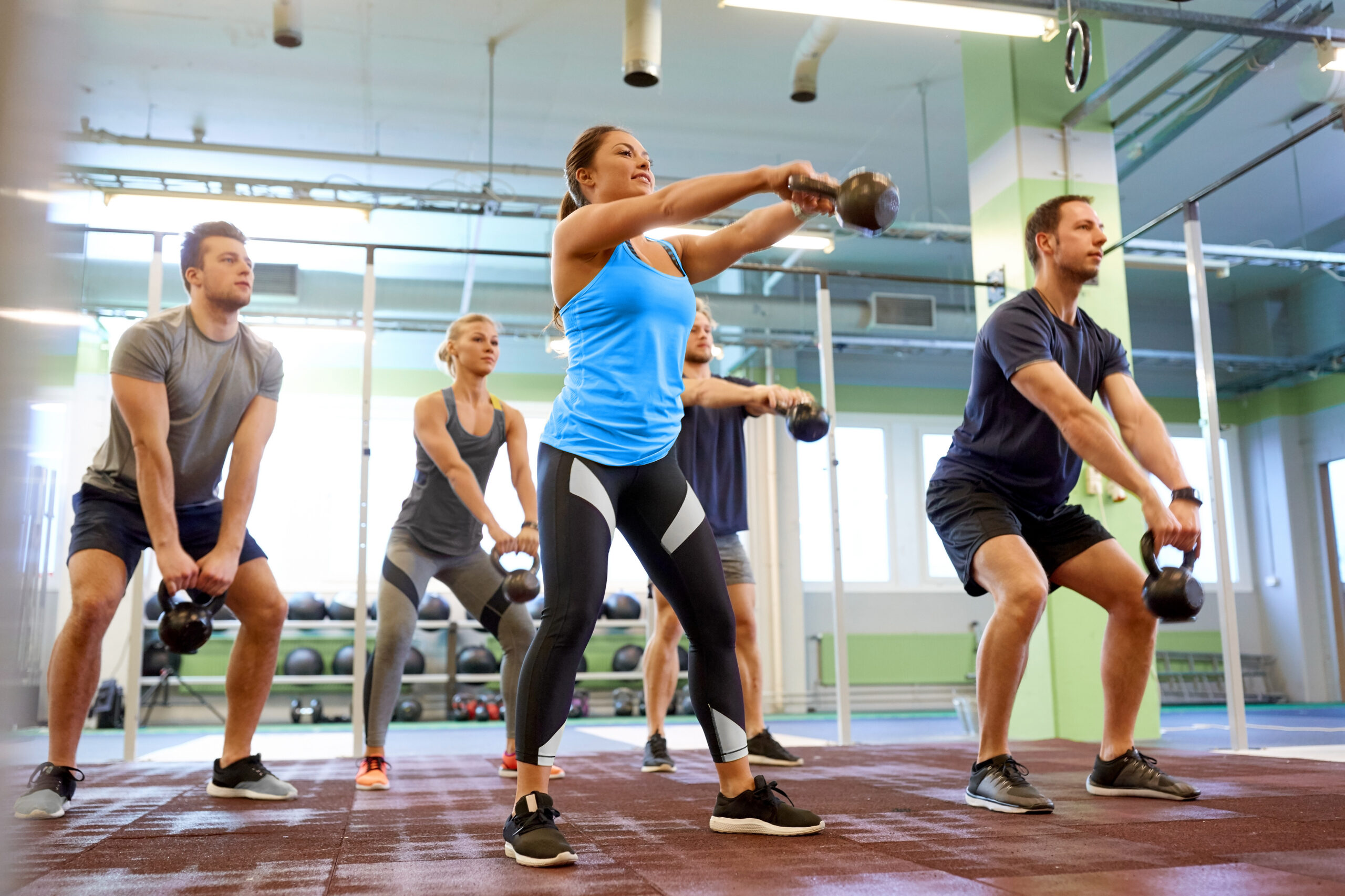 CrossFit athletes training together in an affiliate gym community
