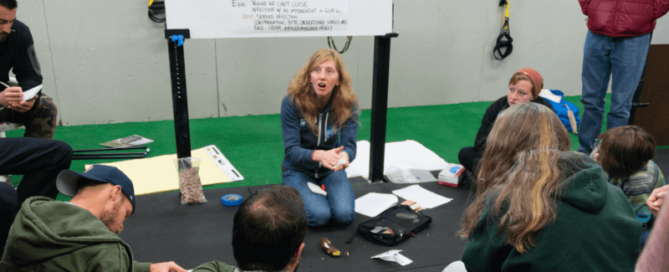 woman kneeling at seminar