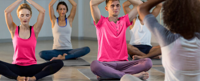 Yoga studio owner reviewing class and membership data on management software