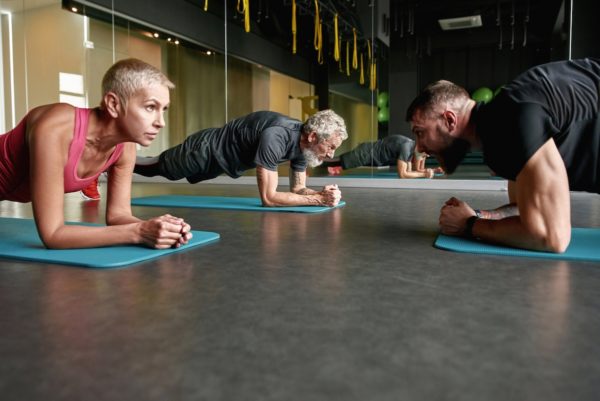 Older athletes doing yoga
