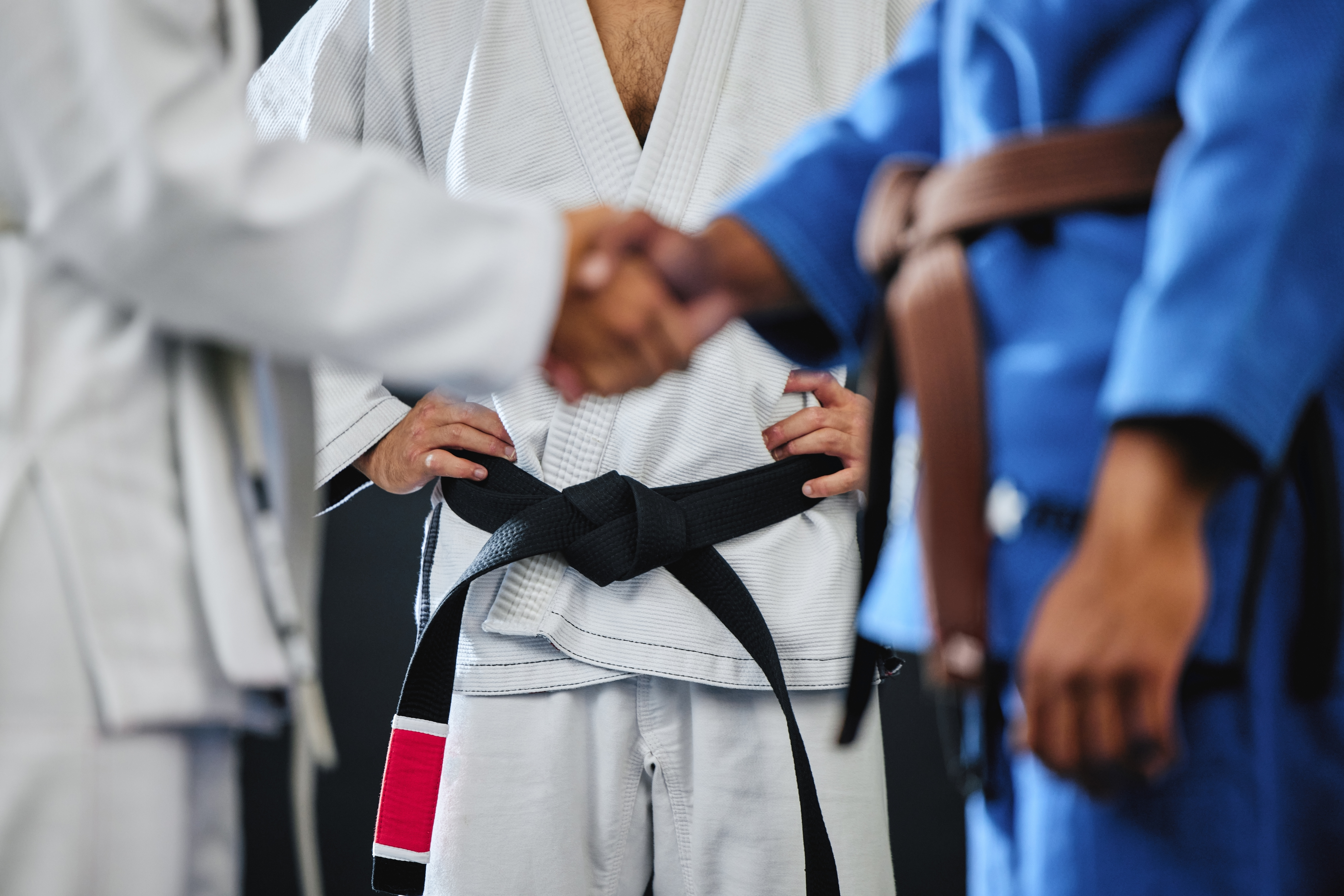Martial arts instructor updating belt rank on student profile in Zen Planner