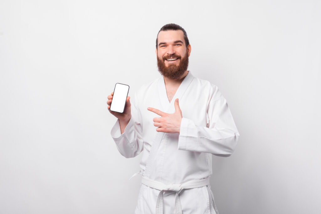 Martial arts instructor reviewing missed check-ins and student attendance gaps on a dashboard