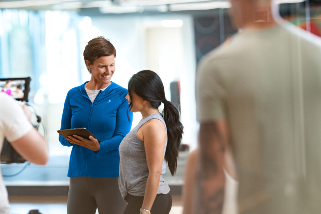 Gym owner reviewing Zen Planner billing software dashboard to track payments