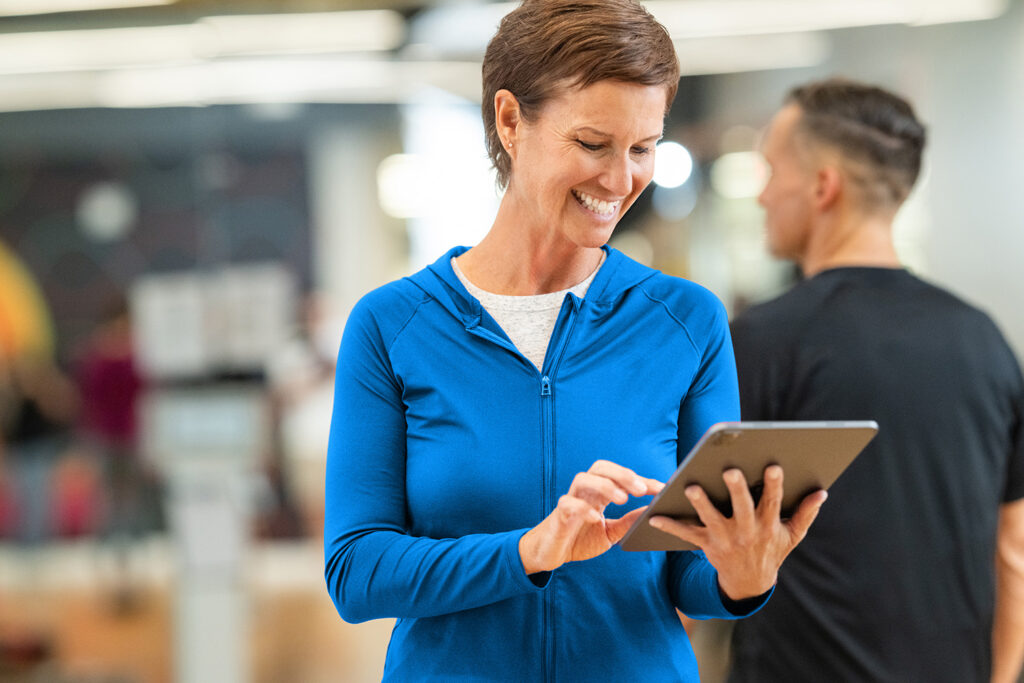 Studio owner reviewing Zen Planner billing dashboard with recurring and one-time payments displayed