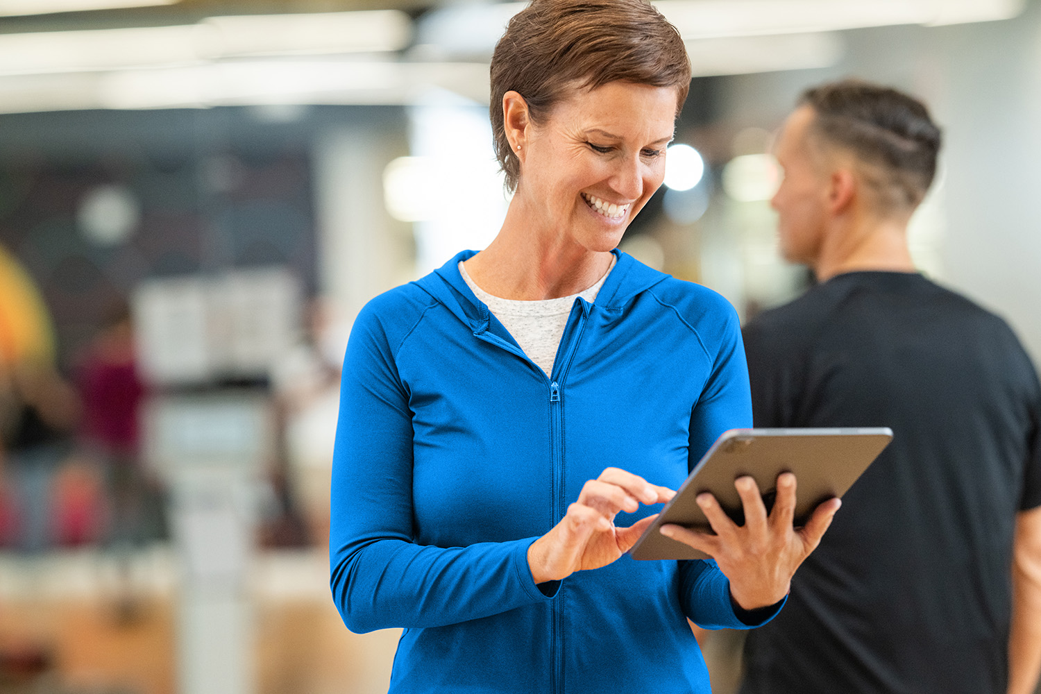 DAXKO-543-agility Studio owner reviewing Zen Planner billing dashboard with recurring and one-time payments displayed