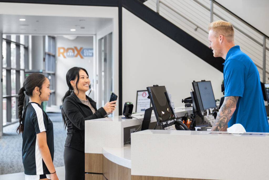 Gym owner using Zen Planner billing dashboard to automate payments