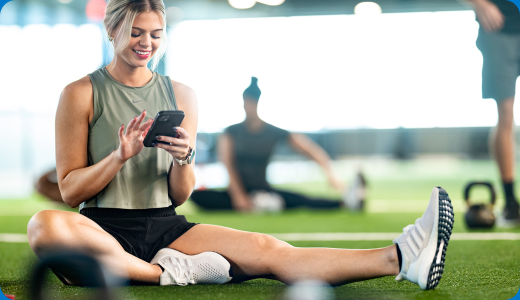 outique gym owner reviewing CRM dashboard with retention metrics