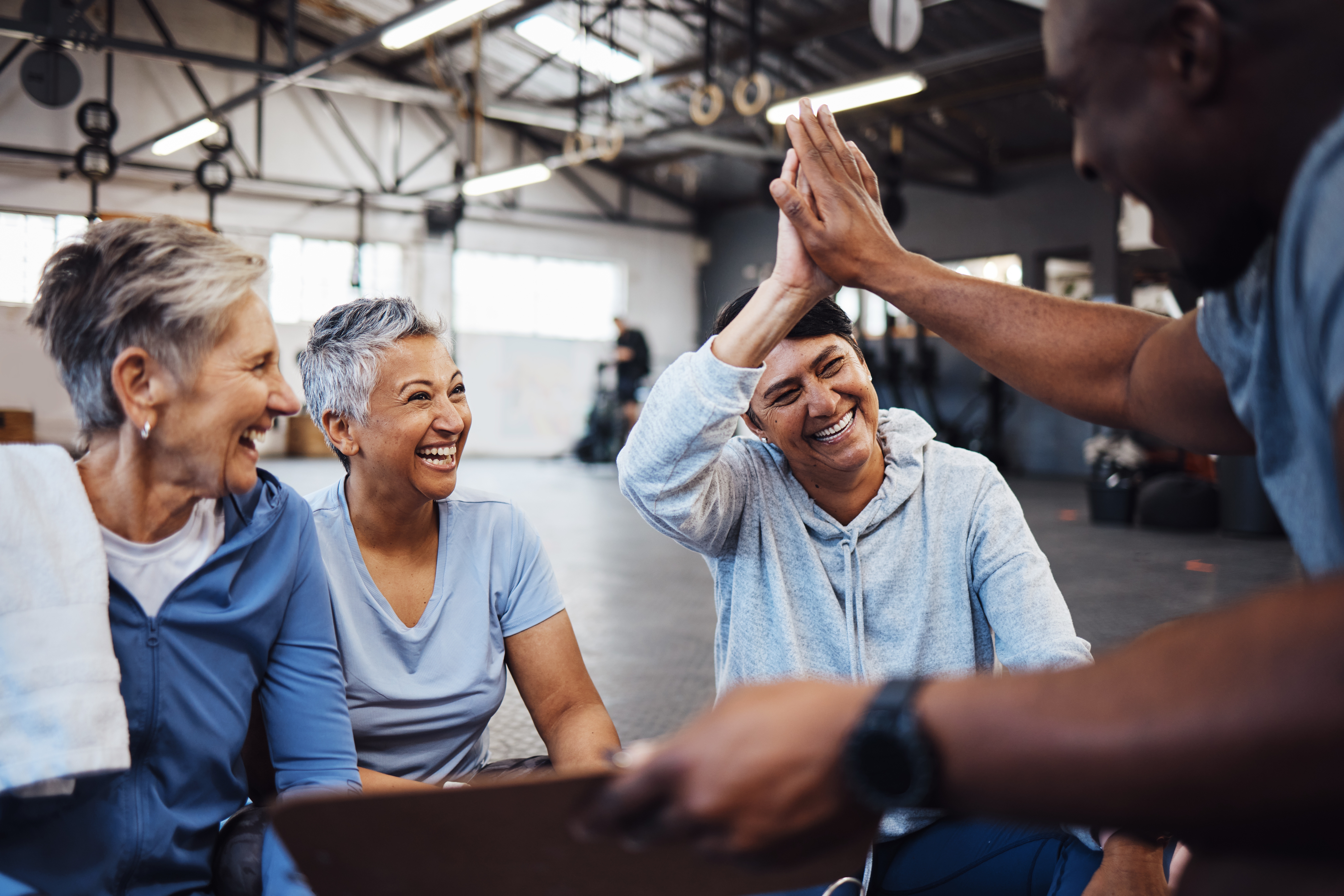 Fitness,,Senior,Women,And,Personal,Trainer,High,Five,For,Health, Zen Planner Engage sending WhatsApp messages to gym members