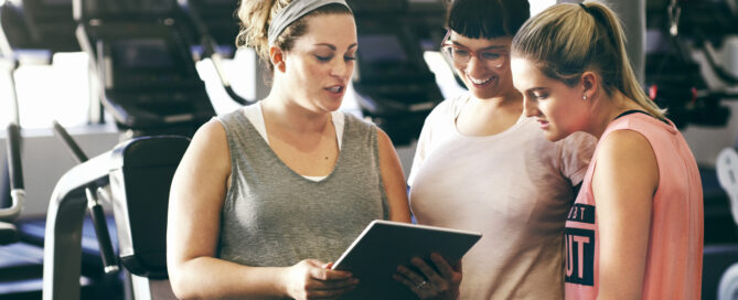 Fitness studio owner using Zen Planner analytics dashboard