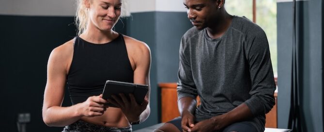 Gym owner reviewing digital marketing performance dashboard