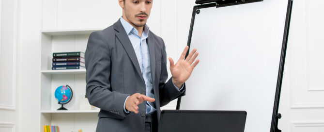 An Instructor Sharing a Promotion Report Through a Martial Arts Software