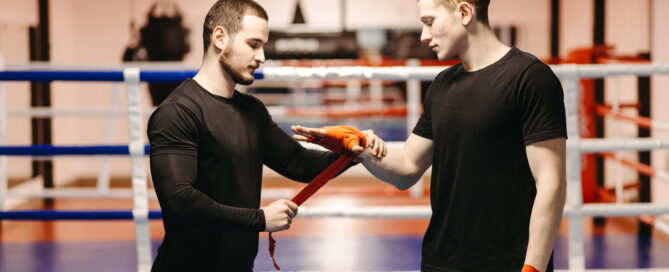 Boxers Preparing for Training in a Gym