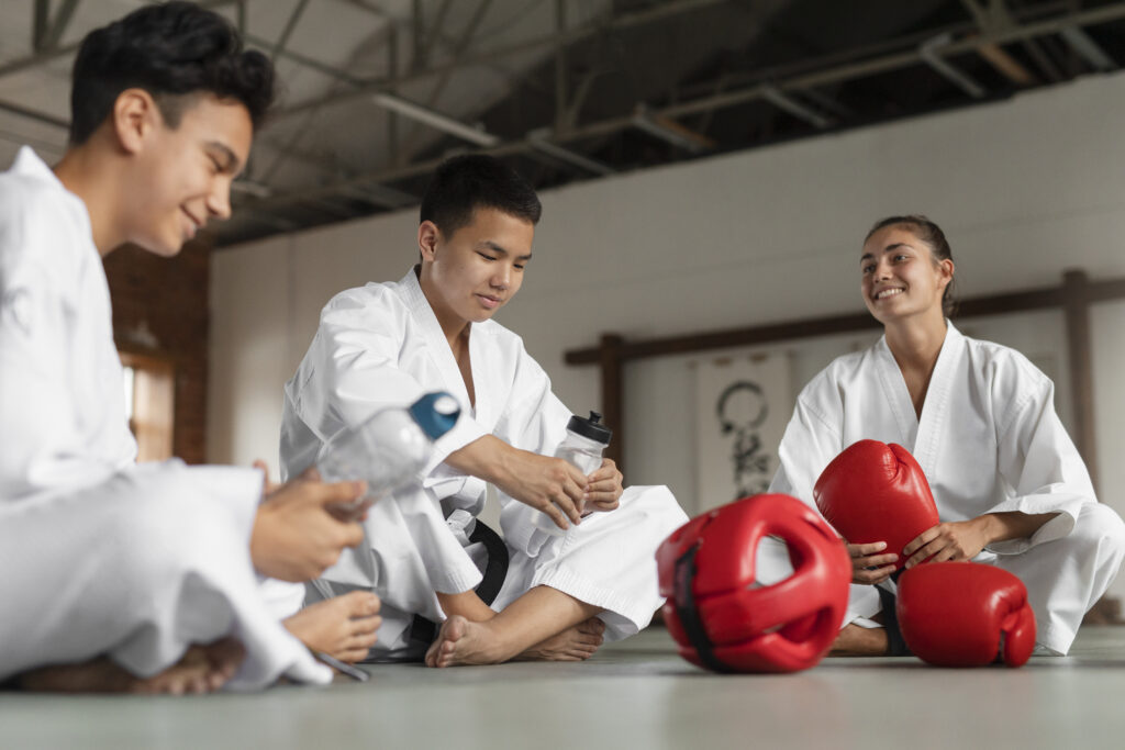Martial Arts Students Relaxing After the Practice Session