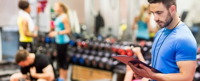 Gym owner comparing billing models on a laptop screen