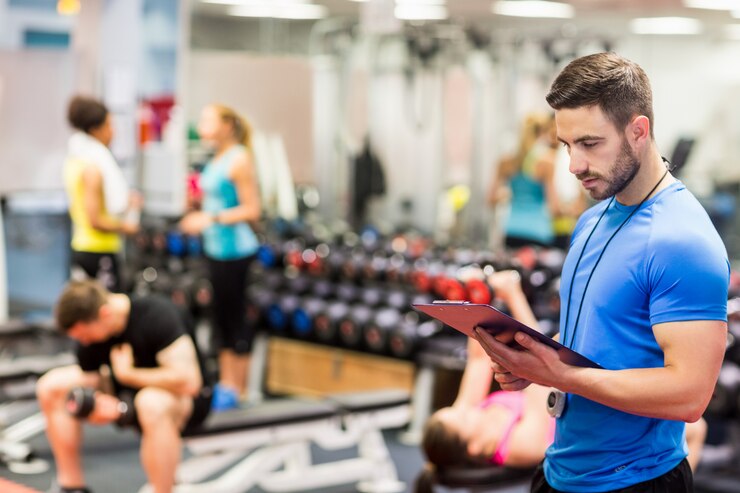 Gym owner comparing billing models on a laptop screen