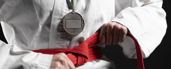 Martial Arts Student with a Medal and New Belt