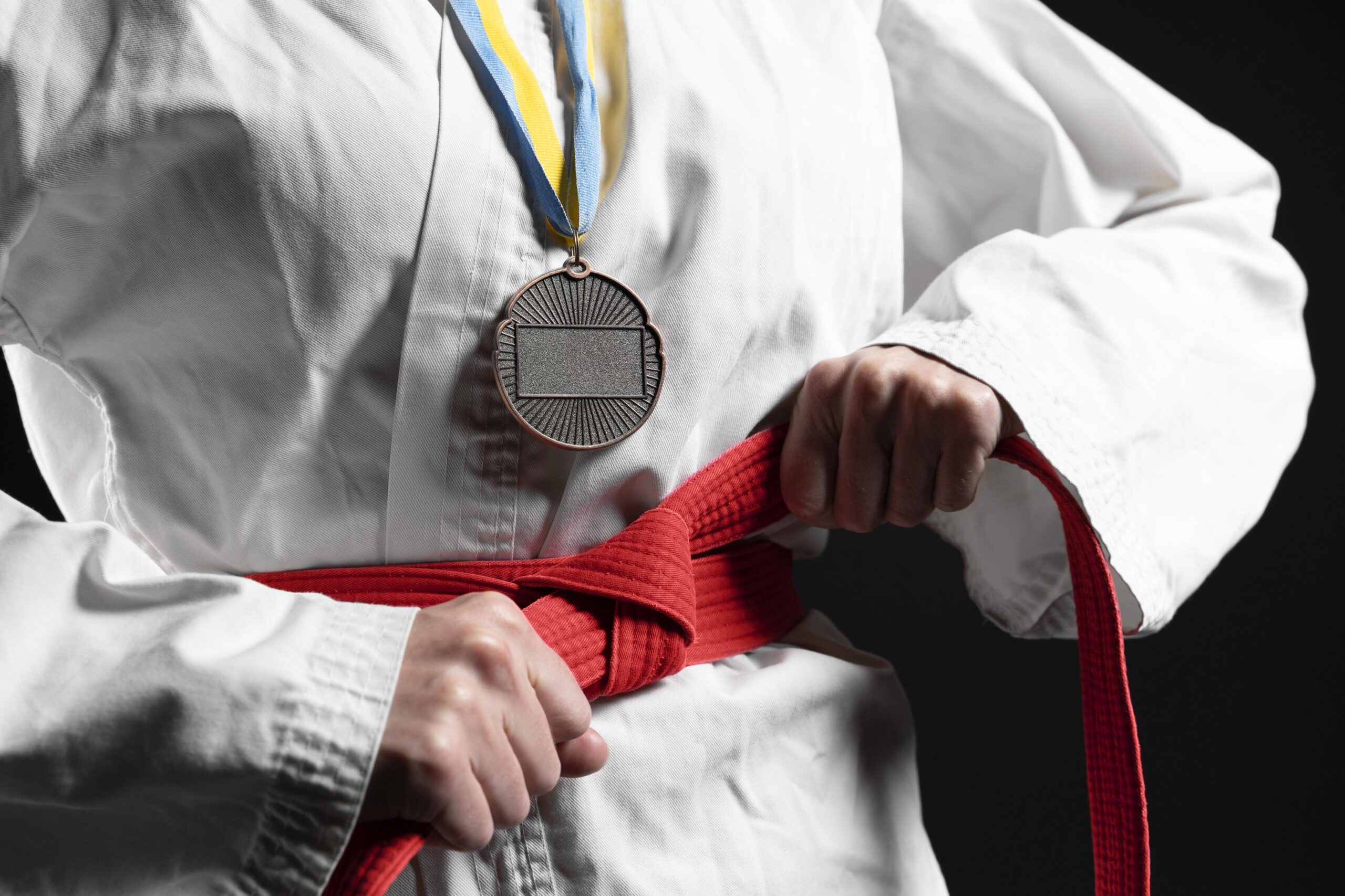 Martial Arts Student with a Medal and New Belt