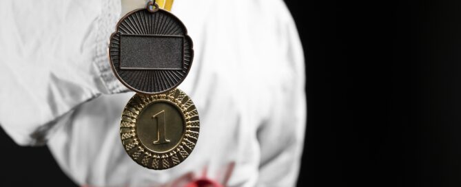 Martial Arts Student Getting a Belt Promotion