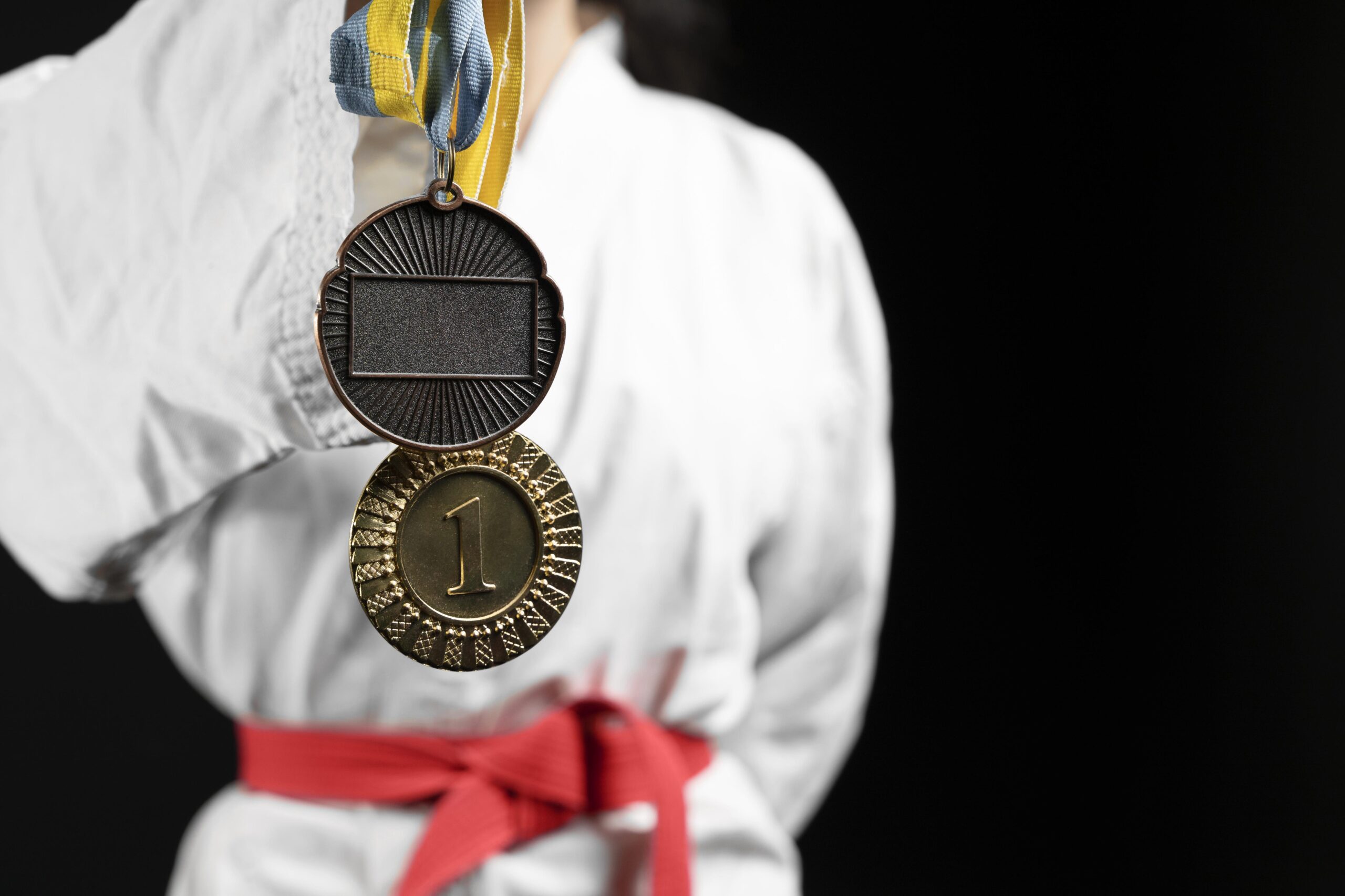 Martial Arts Student Getting a Belt Promotion