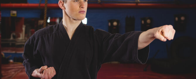 A Martial Arts Player Showing His Skills at a School