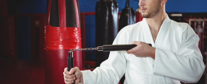 A Martial Arts Student Practicing at a Gymnasium