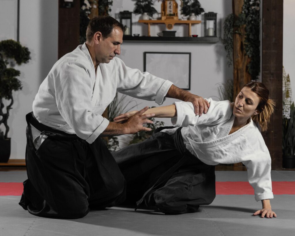 An Instructor Teaching a Student Martial Arts Skills