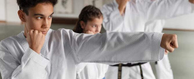 Group of Martial Arts Students Practicing Punching Techniques in a Dojo