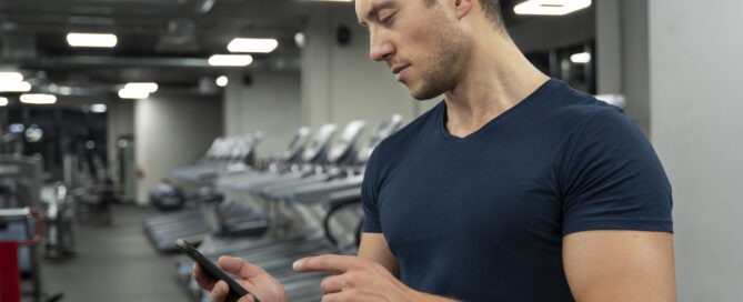 A Gym Owner Using Fitness Management Software to Improve Efficiency