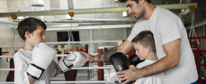 An Instructor Providing Training to Students at a Martial Arts School