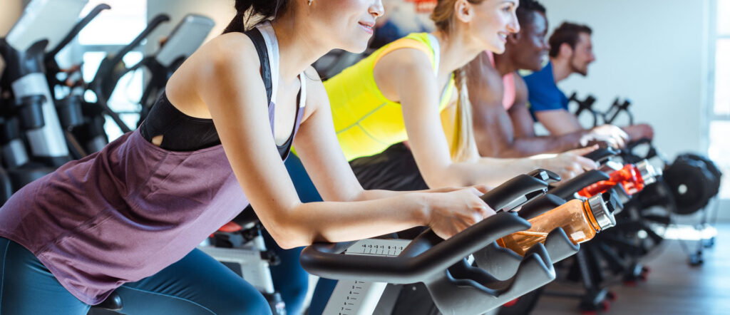 Gym owner reviewing integrated payment dashboard on a fitness management platform