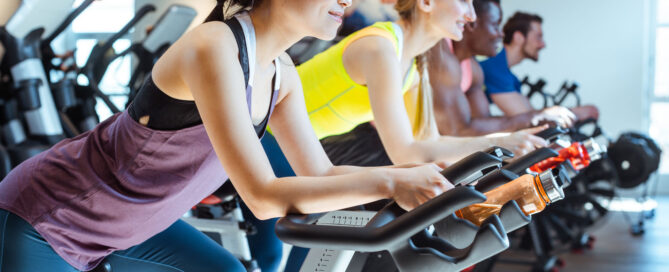 Gym owner reviewing integrated payment dashboard on a fitness management platform