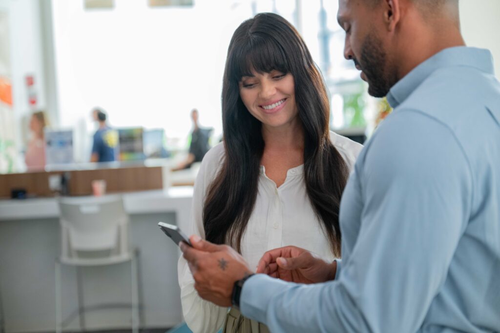 A gym owner using fitness management software to improve efficiency