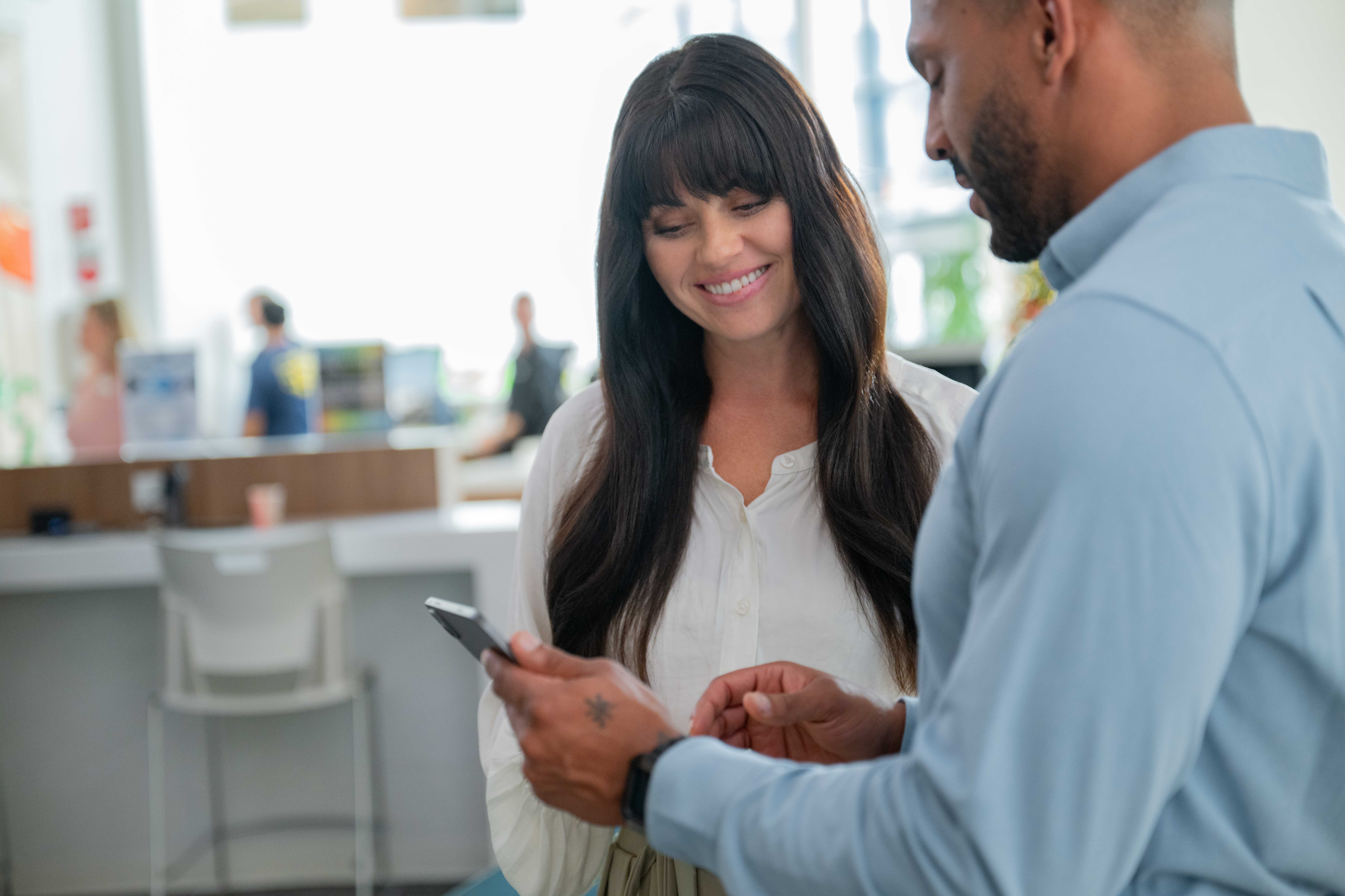 A gym owner using fitness management software to improve efficiency