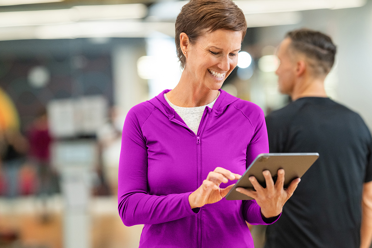 DAXKO-543-core Fitness studio owner managing scheduling and memberships through fitness management software