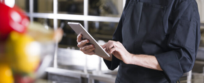 Gym owner checking payment dashboard on software