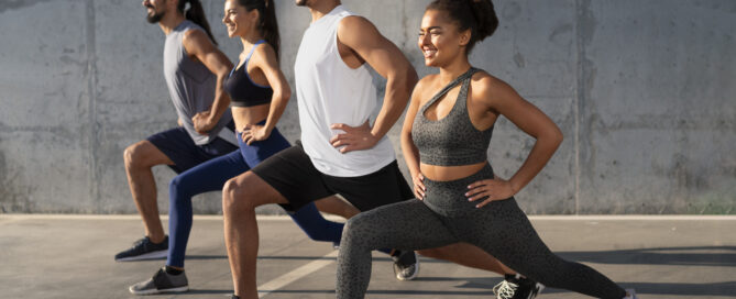 People practising yoga at fitness class
