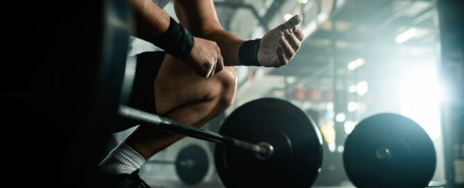 Man preparing for weightlifting in a gym