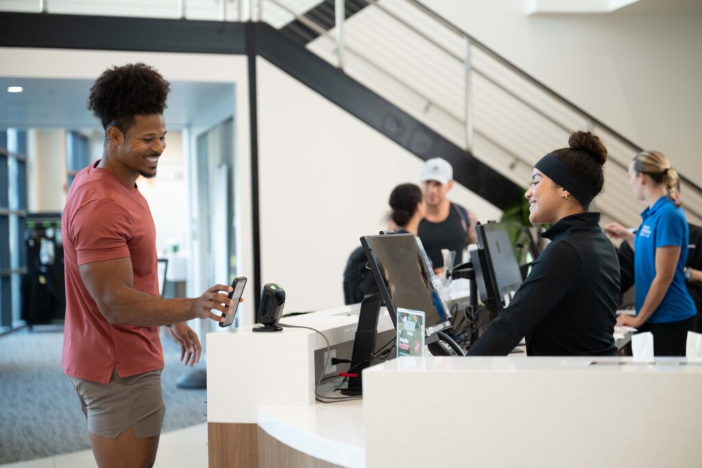 Fitness studio owner using software to manage scheduling and members