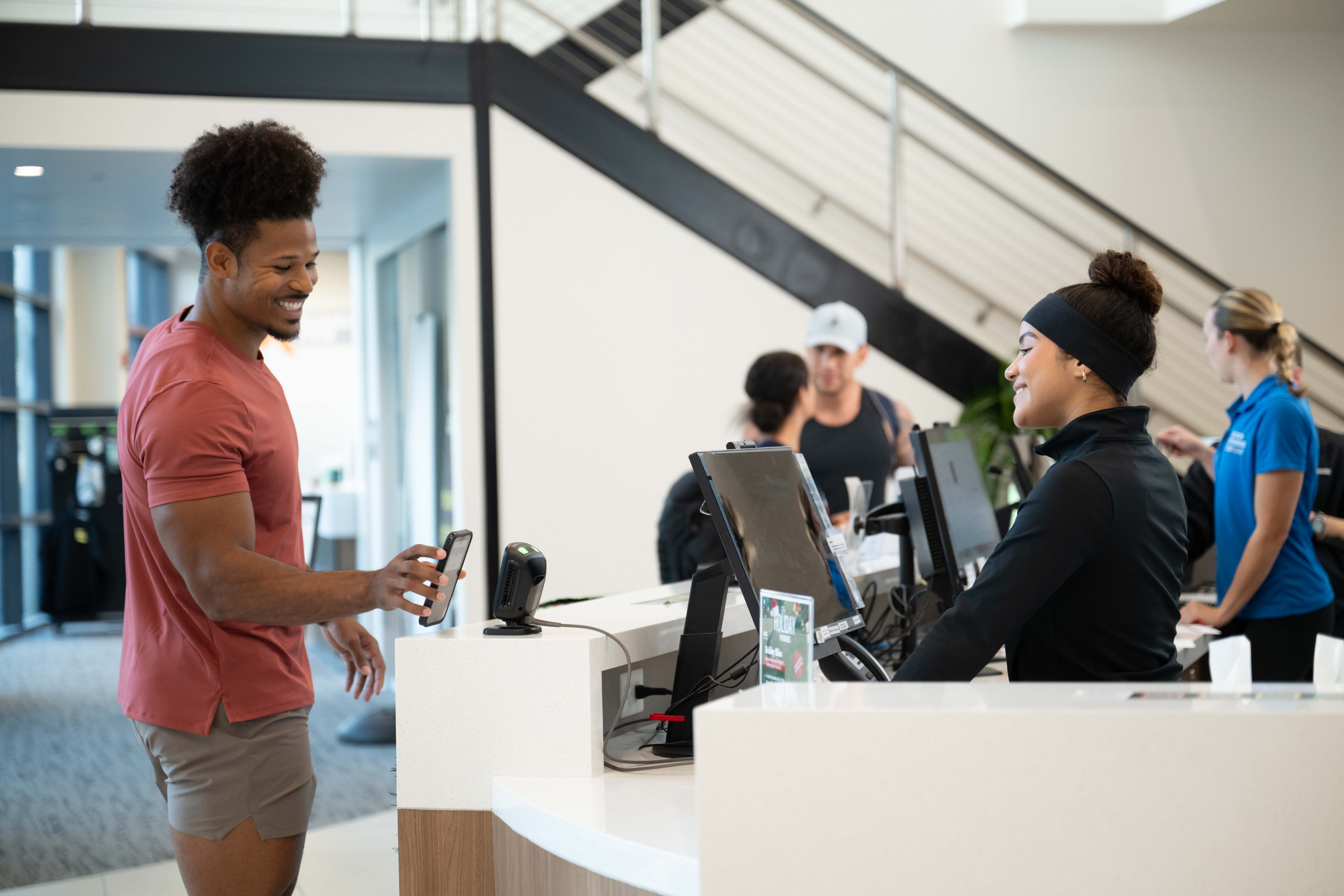 Fitness studio owner using software to manage scheduling and members