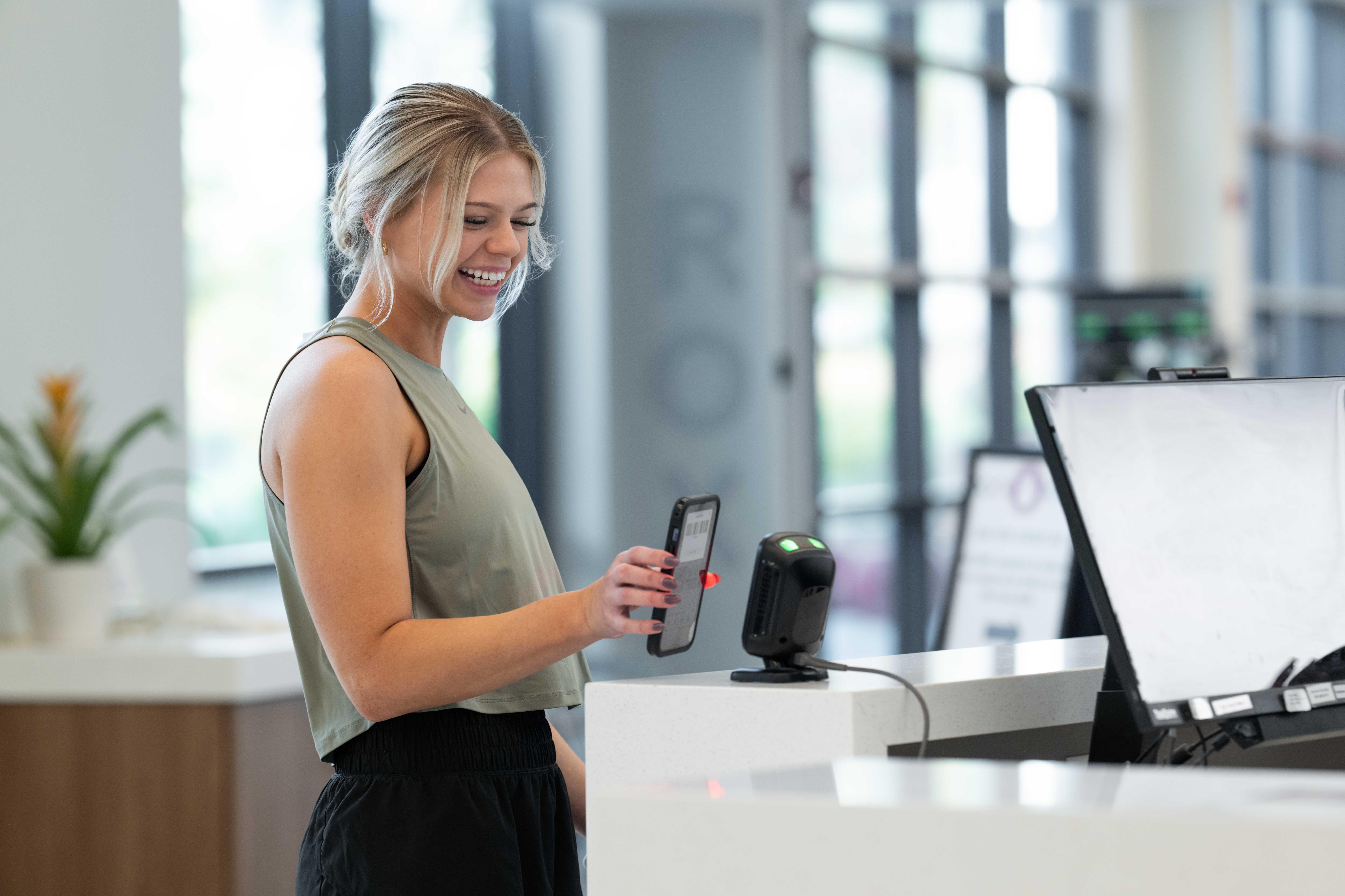 gym owner using gym membership software dashboard on laptop