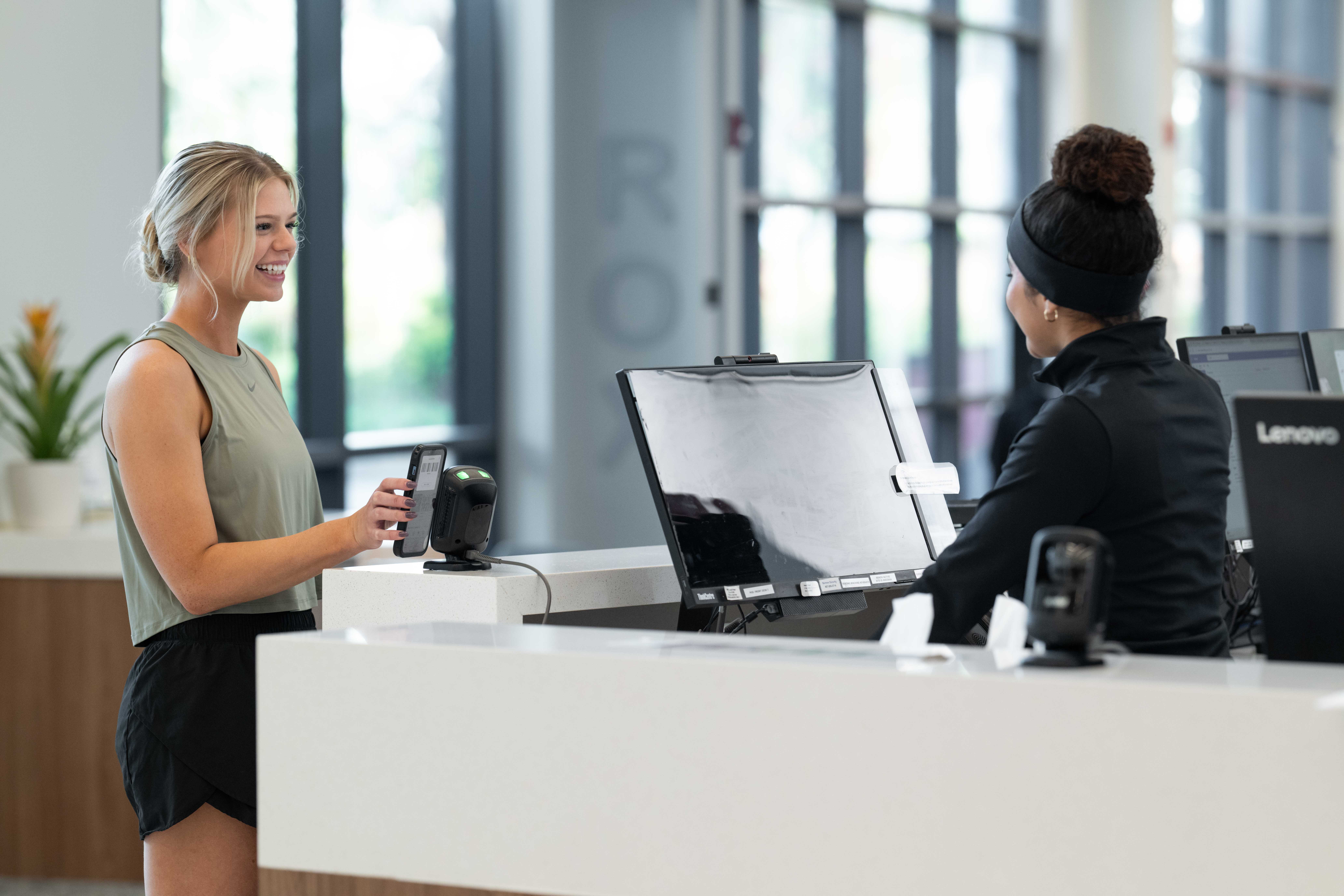 DAXKO-123 Martial arts instructor using CRM software to communicate with students