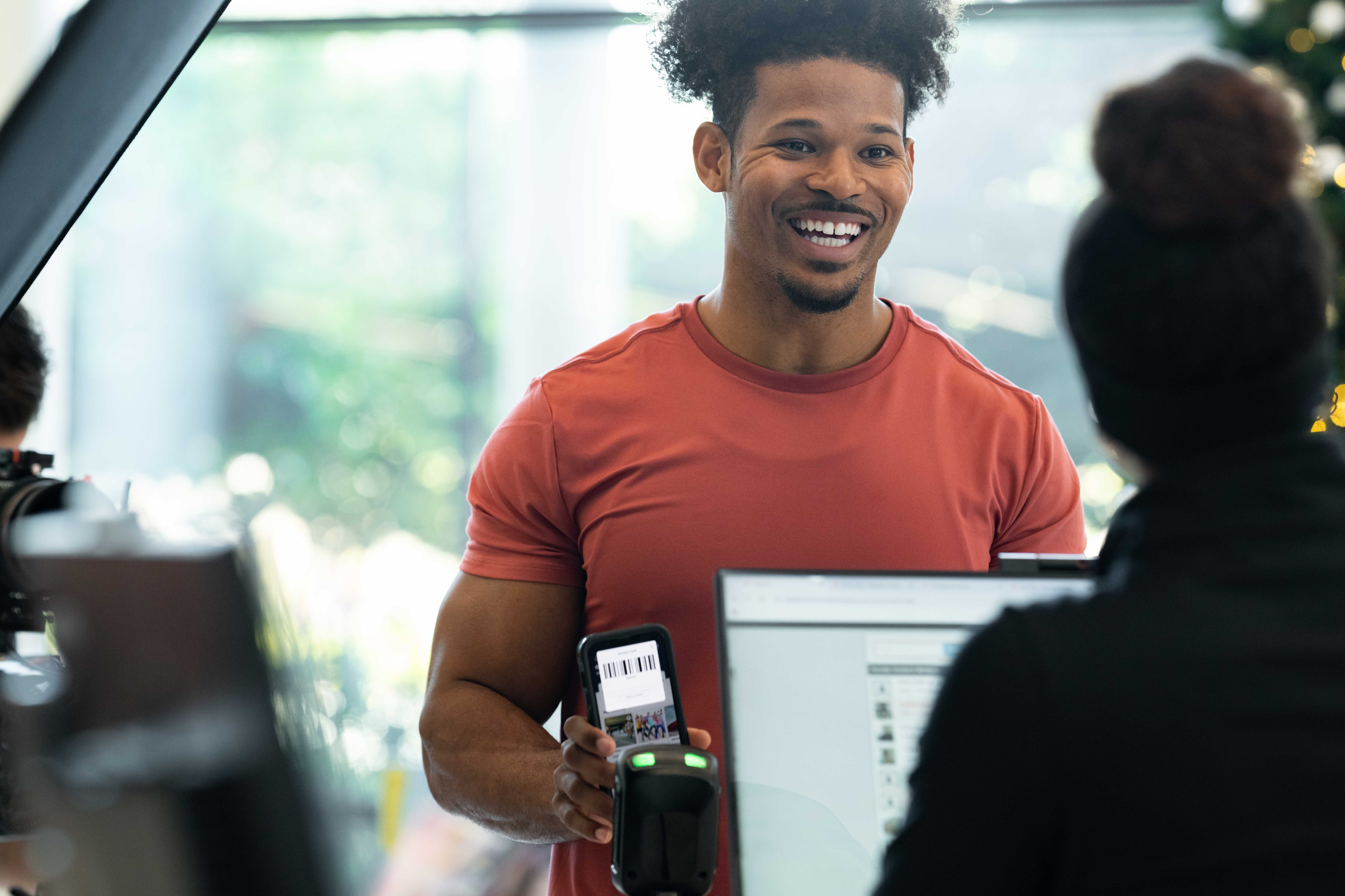 Gym owner using Zen Planner Engage software to communicate with members