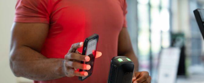 A fitness studio owner comparing management software options