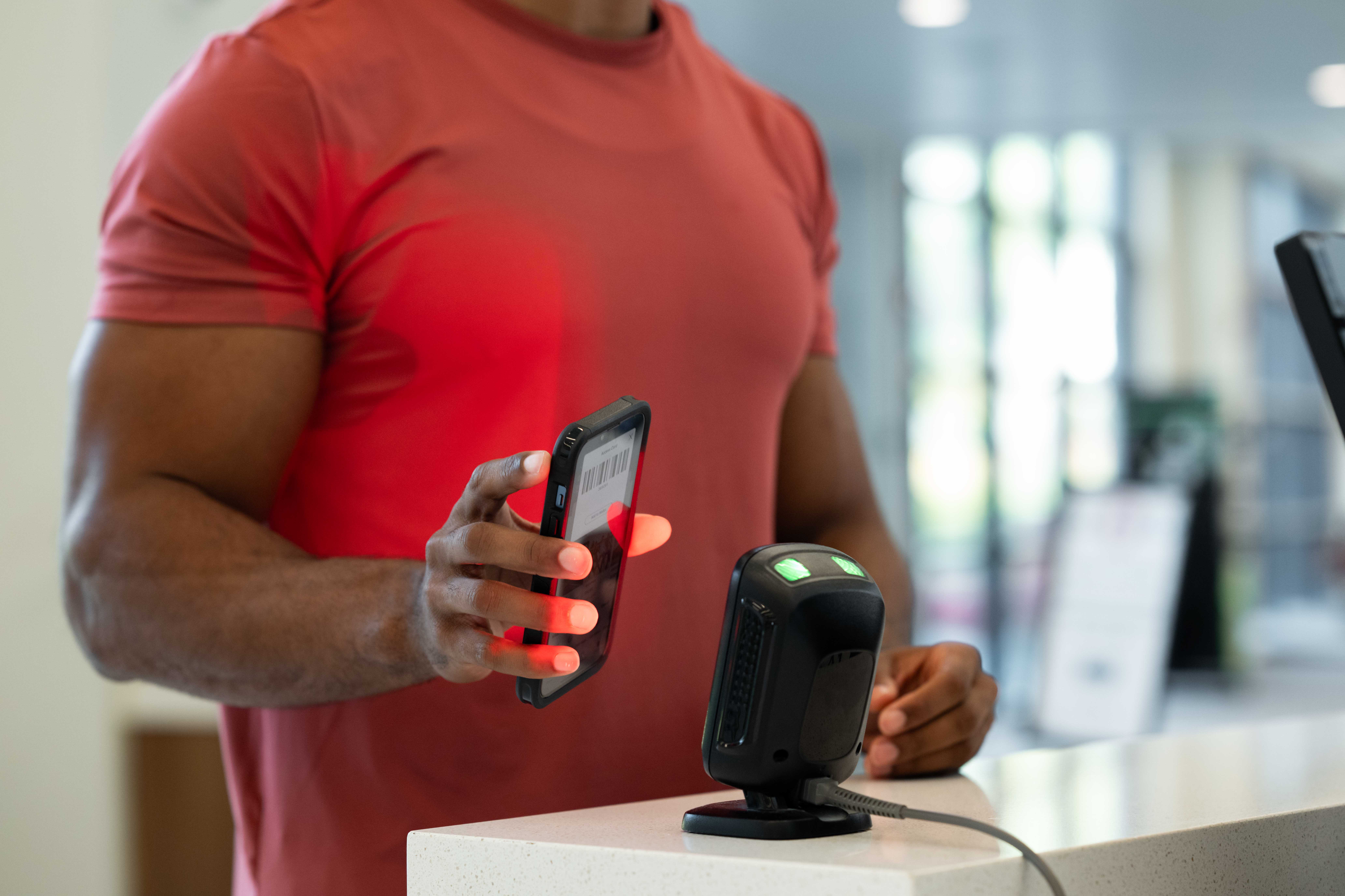 A fitness studio owner comparing management software options