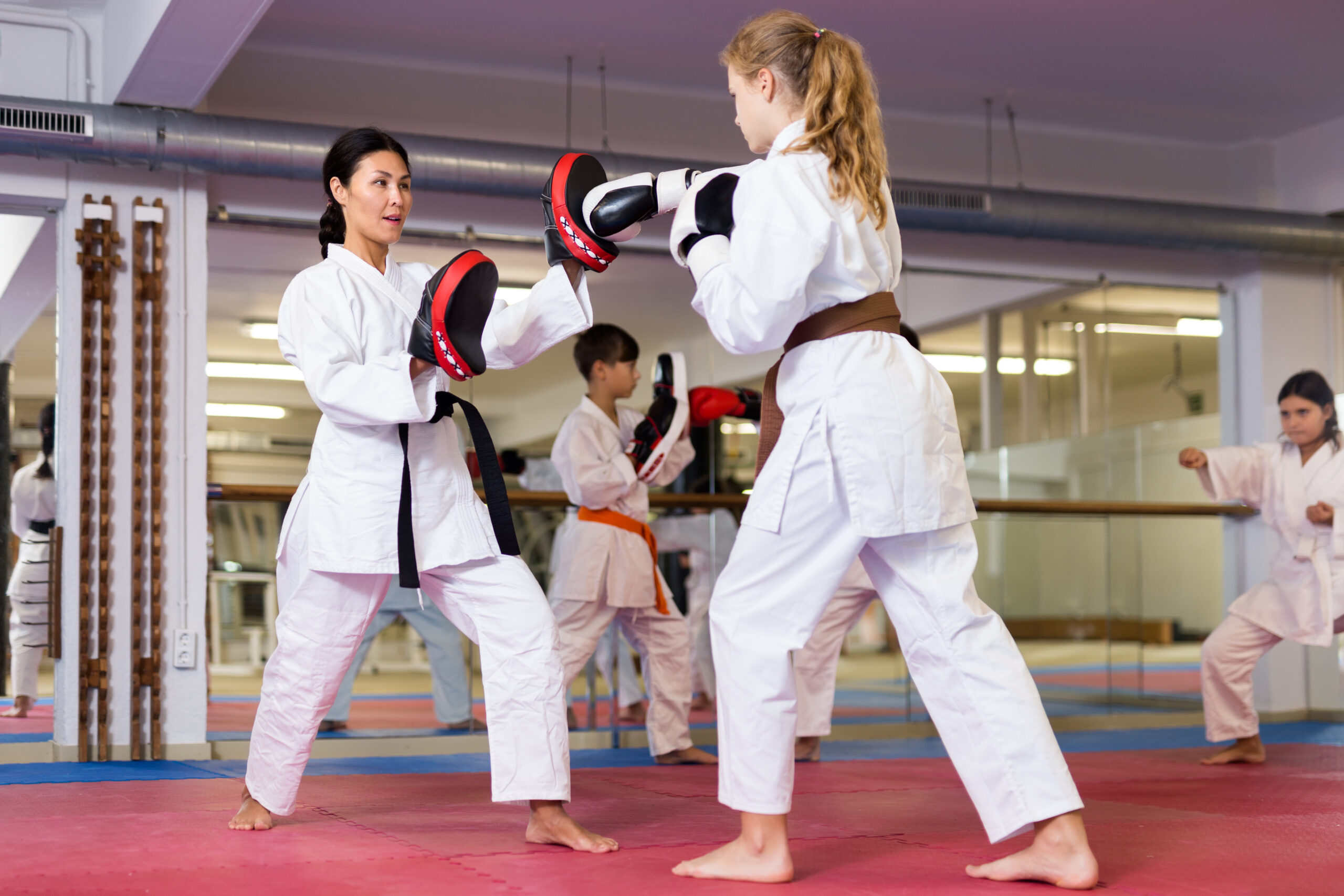 Martial arts student signing digital waiver form on a tablet