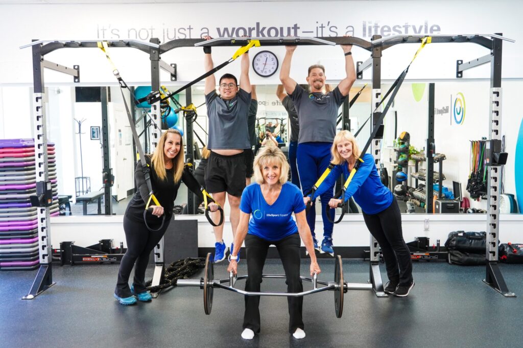 Becky coaches a semi-private session at LifeSport Fitness, guiding clients through personalized programs.