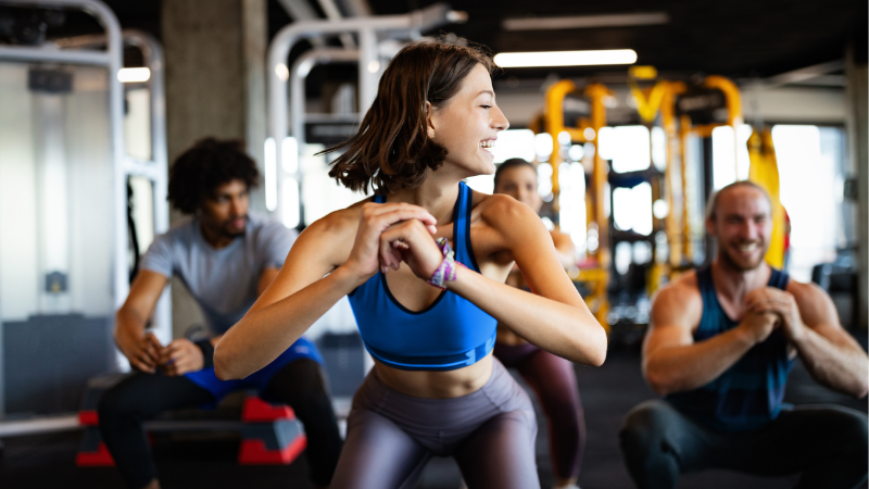 Gym members making the most of AI and automation strategies for fitness business growth.