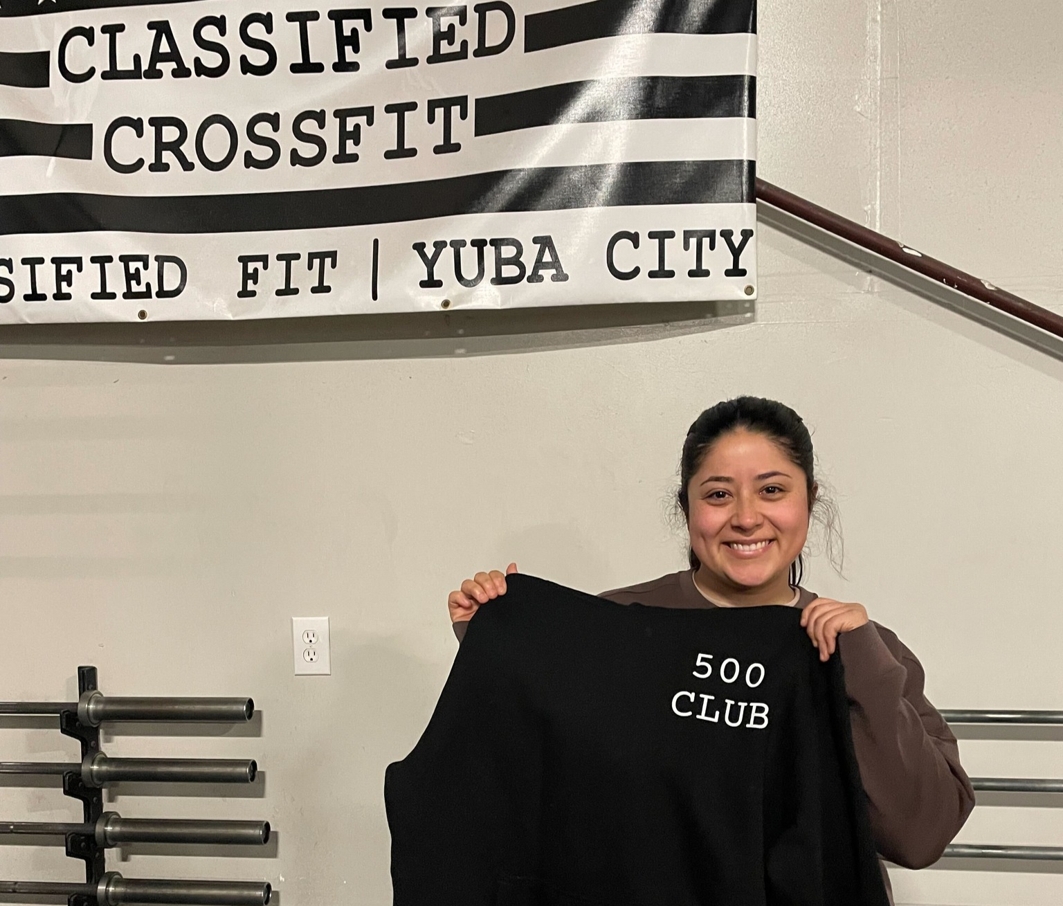 A member of Classified Fitness at Yuba city celebrating a milestone of completing 500 classes at the gym.